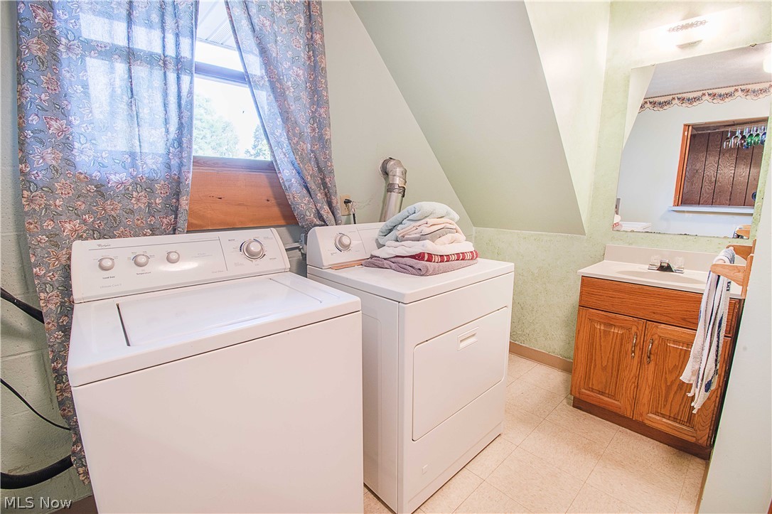 1272 Stewart Road Salem, OH 44460 - Photo 30 of 30 The laundry room is spacious and has a full bathroom with a walk-in shower.