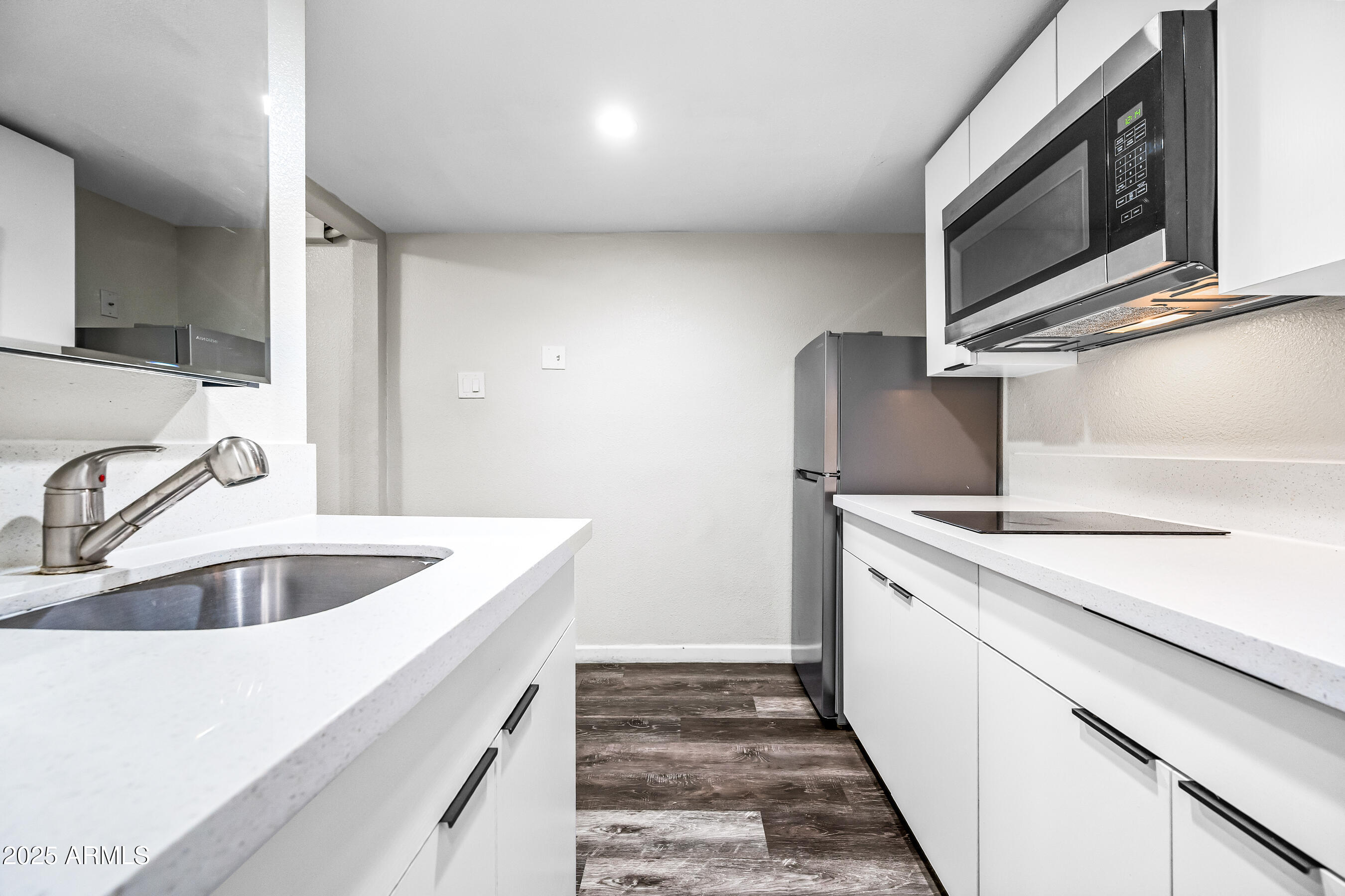 3025 North 32nd Street, Unit 10 Phoenix, AZ 85018 - Photo 11 of 21 a kitchen with a sink and a refrigerator