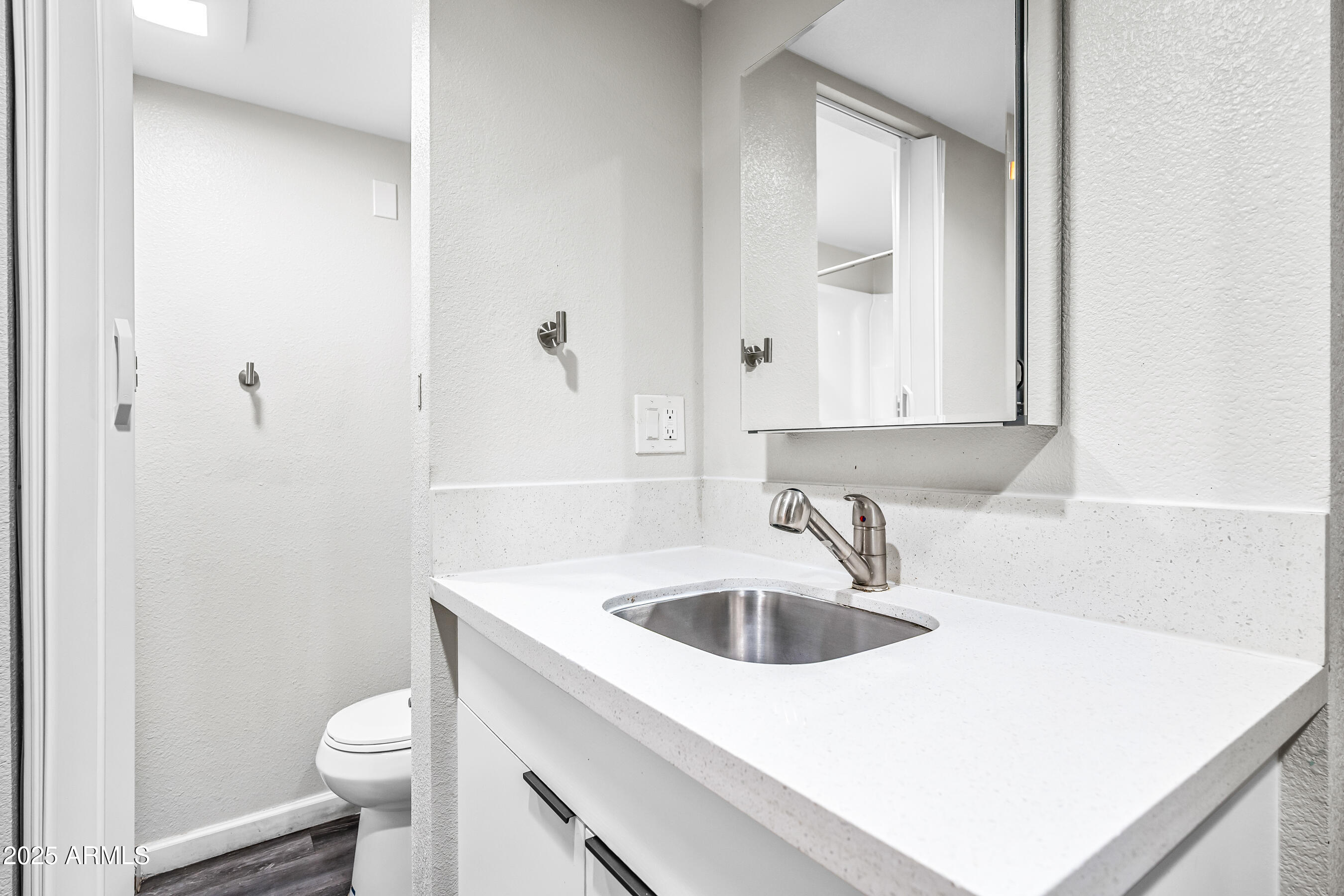 3025 North 32nd Street, Unit 10 Phoenix, AZ 85018 - Photo 9 of 21 a bathroom with a sink and a toilet