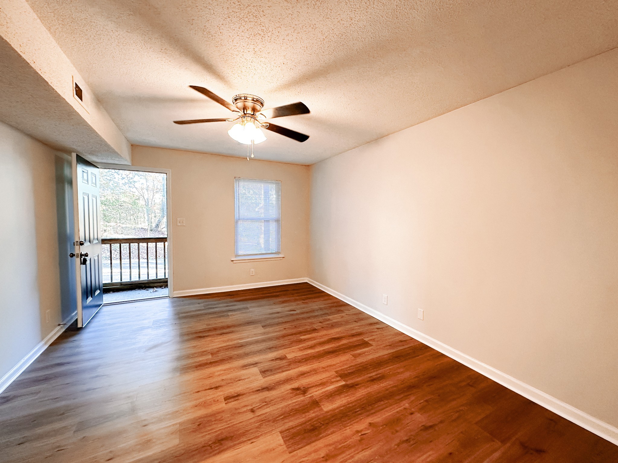 470 Martha Lane, Unit B Clarksville, TN 37043 - Photo 3 of 27 wooden floor in an empty room with a window