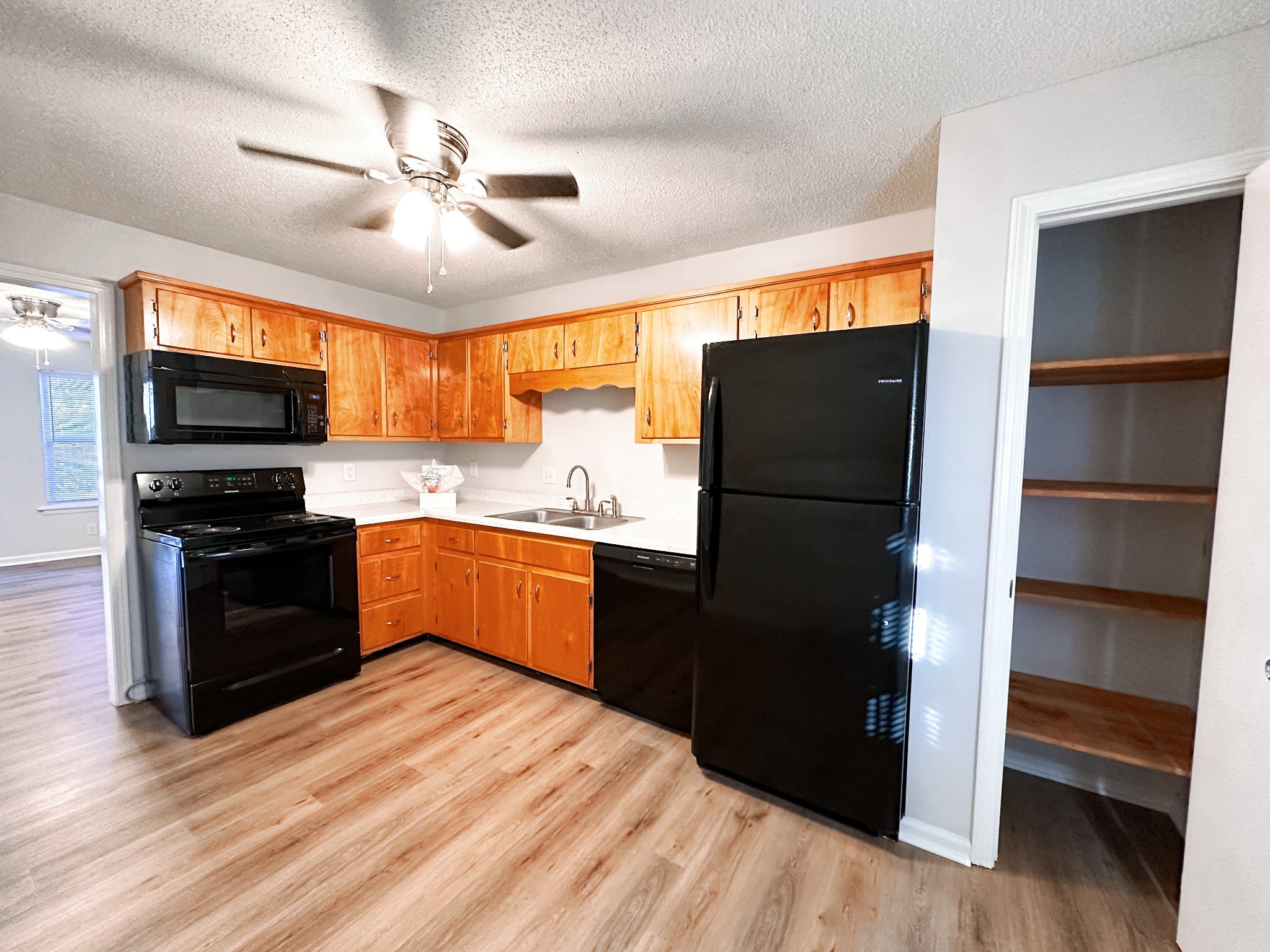 470 Martha Lane, Unit B Clarksville, TN 37043 - Photo 9 of 27 a kitchen with granite countertop stainless steel appliances and wooden floor