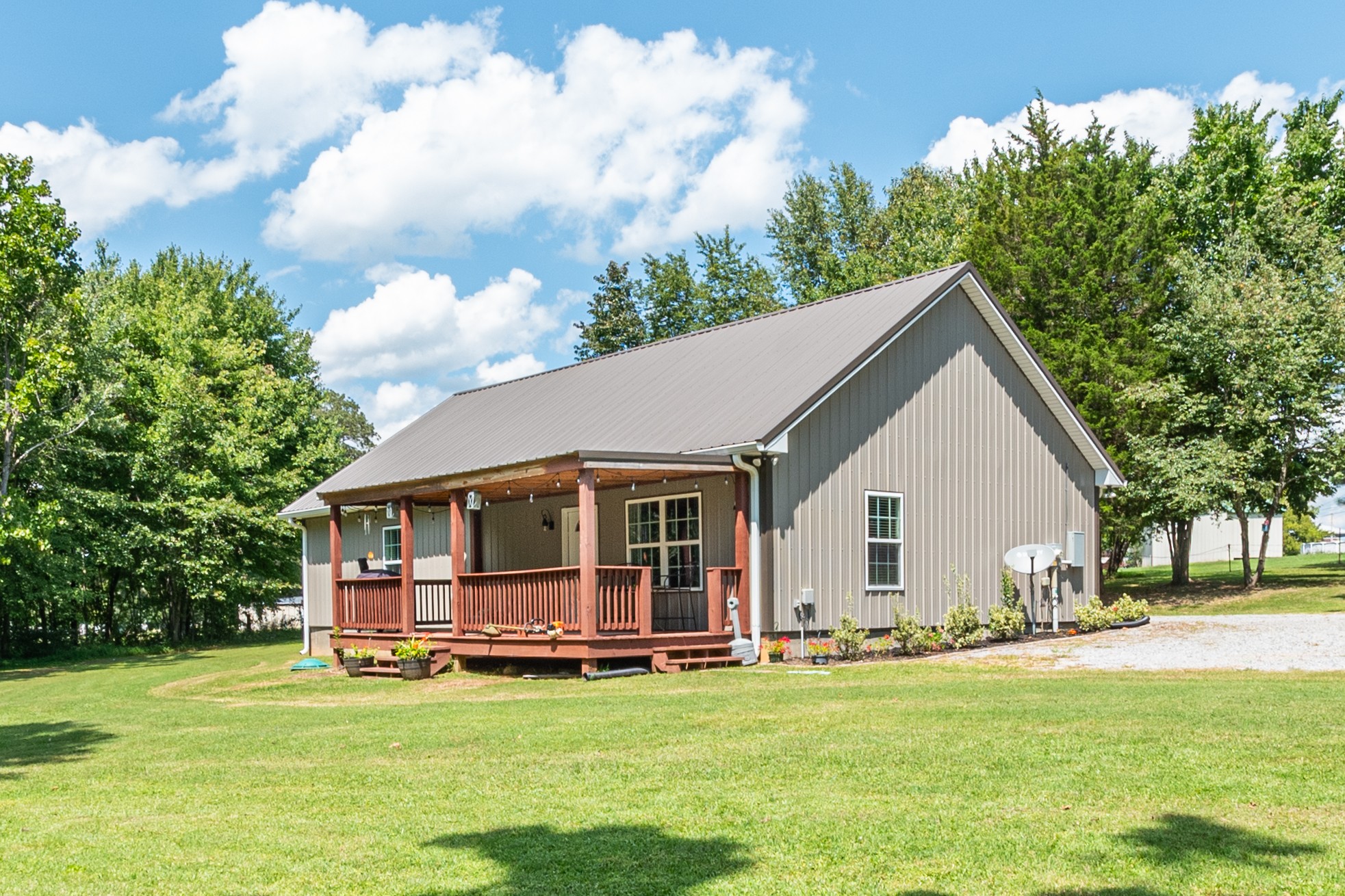 a view of a house with pool and yard