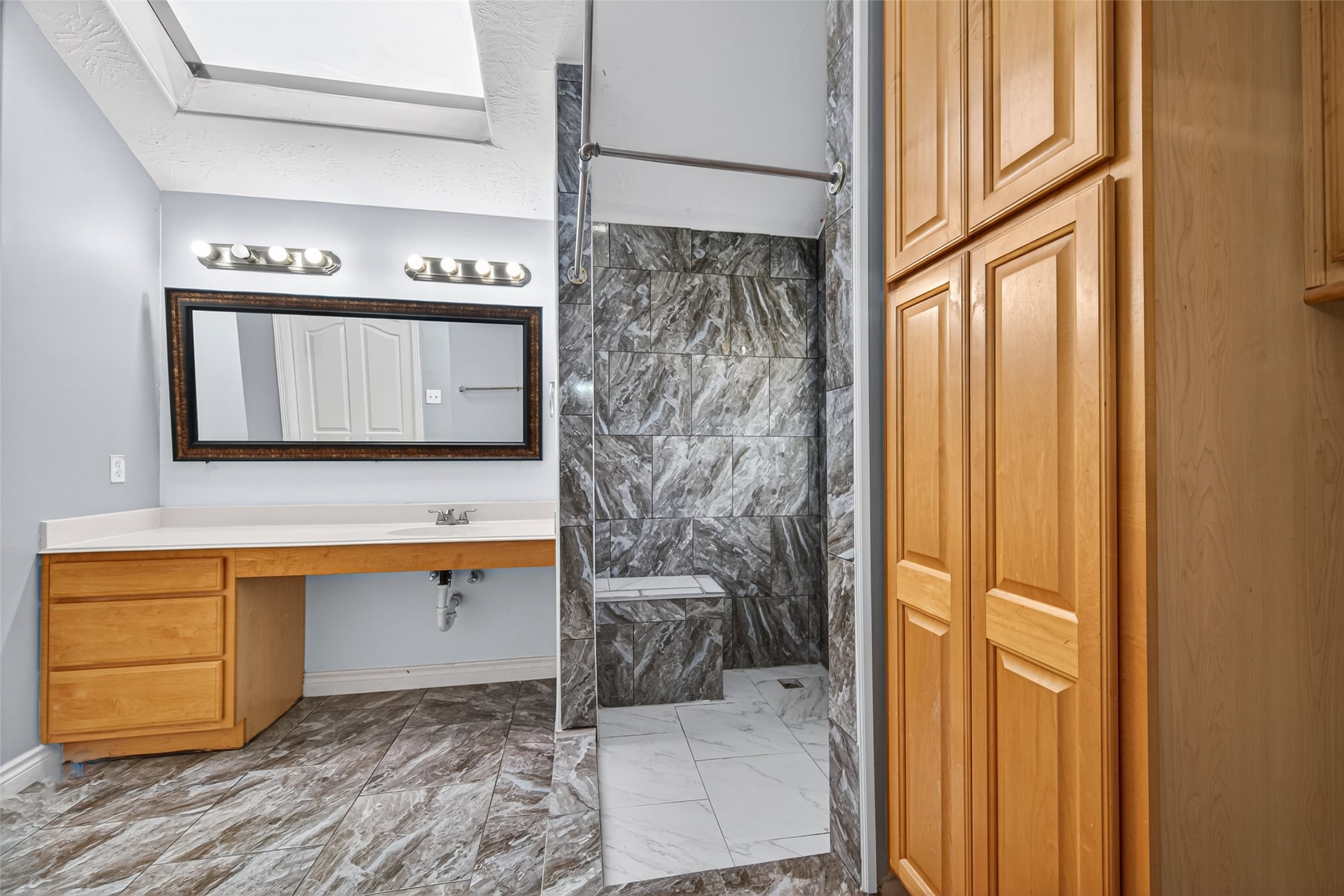 23914 Glengate Drive Spring, TX 77373 - Photo 26 of 49 a bathroom with a bathtub and a shower