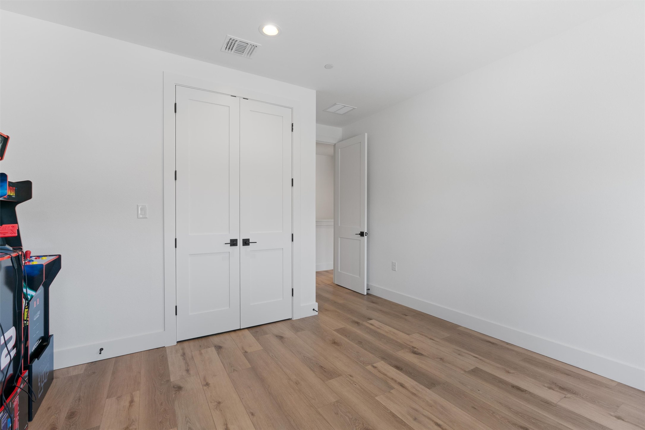 590 Old Mill Road, Unit 153 Cedar Park, TX 78613 - Photo 18 of 40 a view of an empty room with wooden floor