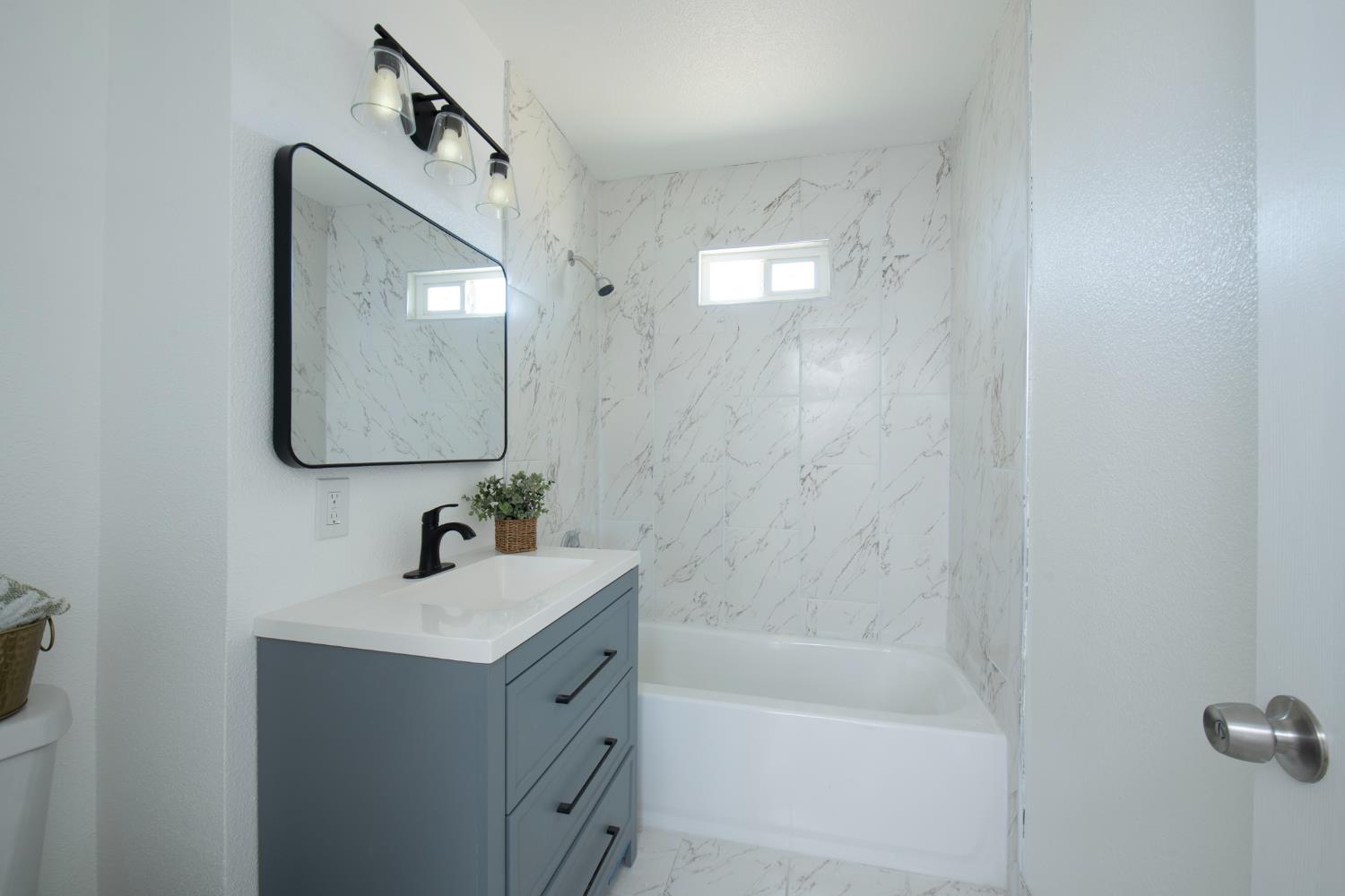 266 L Street Mendota, CA 93640 - Photo 11 of 21 a bathroom with a sink and a mirror