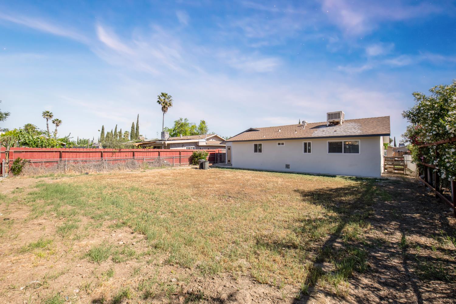 266 L Street Mendota, CA 93640 - Photo 21 of 21 a view of a big room with a big yard and plants