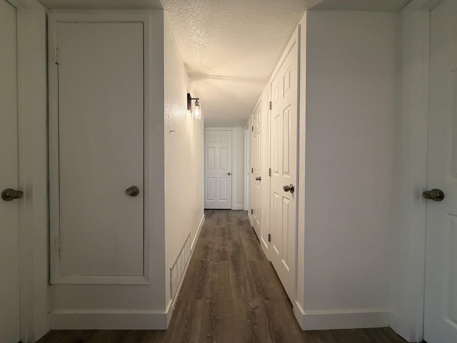 266 L Street Mendota, CA 93640 - Photo 10 of 21 a view of a hallway with wooden floor and closet area