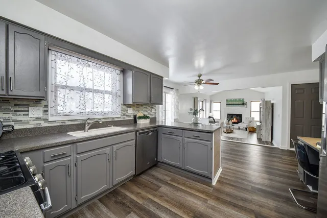a bathroom with a sink mirror and toilet