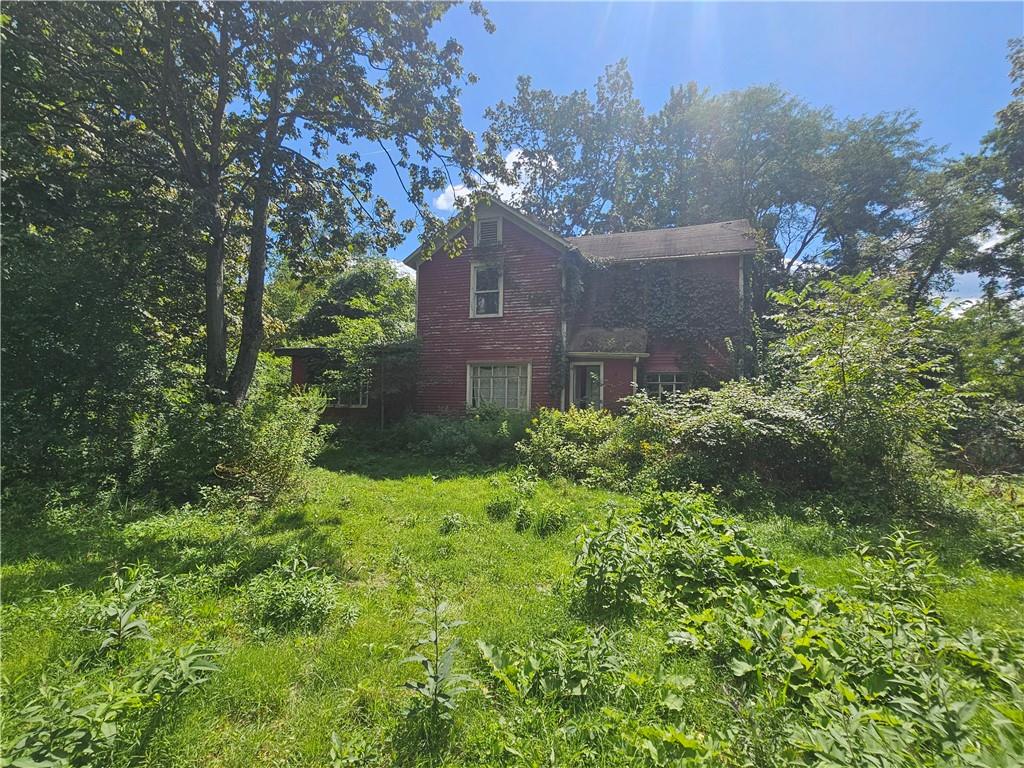 977 Glen Road New Castle, PA 16105 - Photo 8 of 22 a view of a house with a yard and a large tree