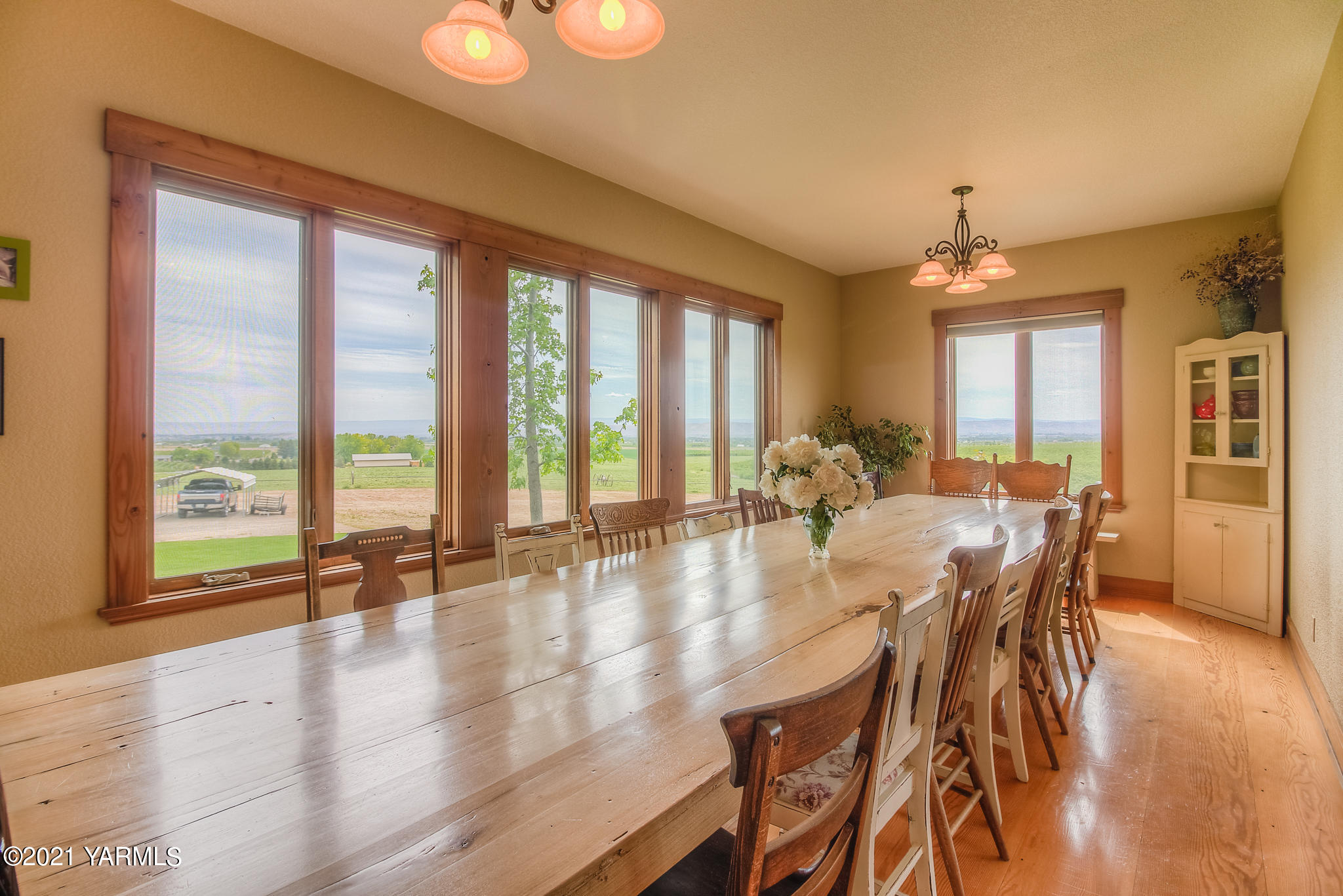 3050 Thacker Road Zillah, WA 98953 - Photo 14 of 64 a view of a dining room with furniture window and wooden floor