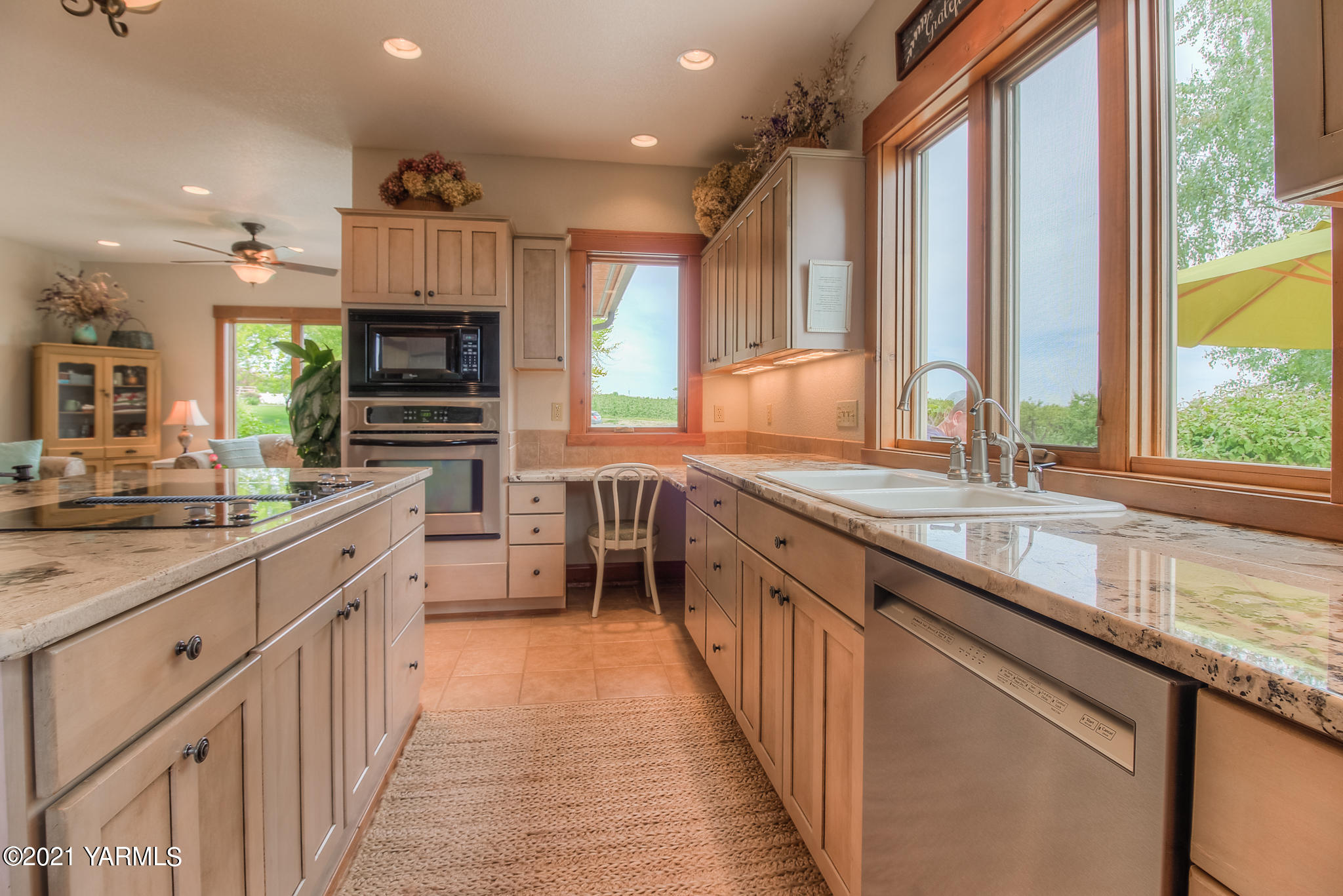 3050 Thacker Road Zillah, WA 98953 - Photo 21 of 64 a kitchen with stainless steel appliances a sink stove and cabinets