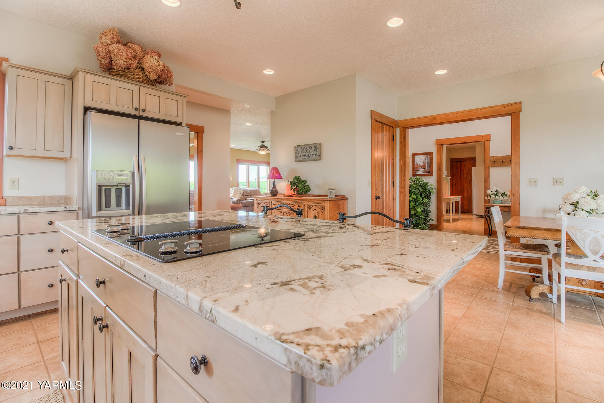 3050 Thacker Road Zillah, WA 98953 - Photo 22 of 64 a large kitchen with kitchen island a sink counter space and a stove