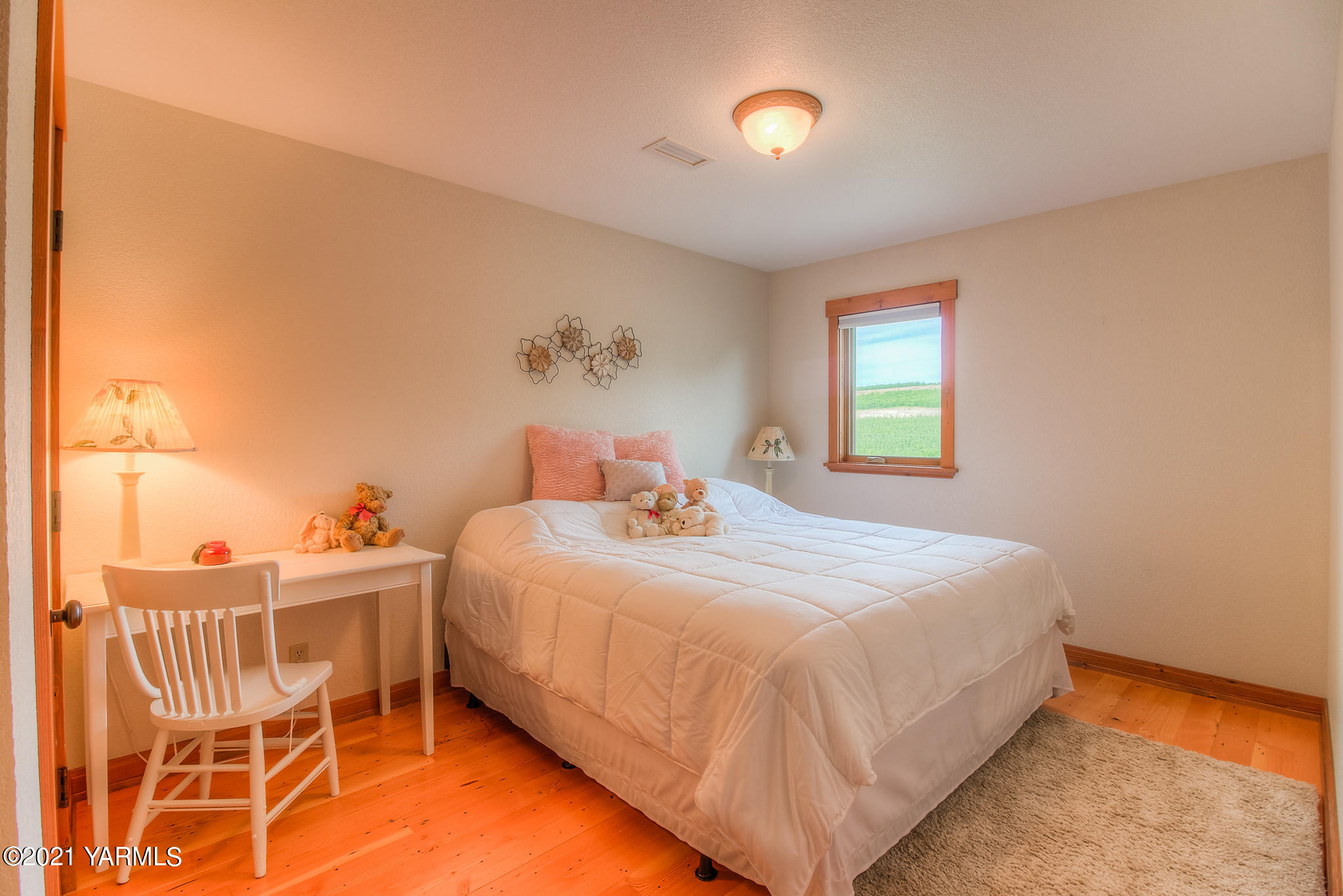 3050 Thacker Road Zillah, WA 98953 - Photo 42 of 64 a bedroom with a bed and a chandelier