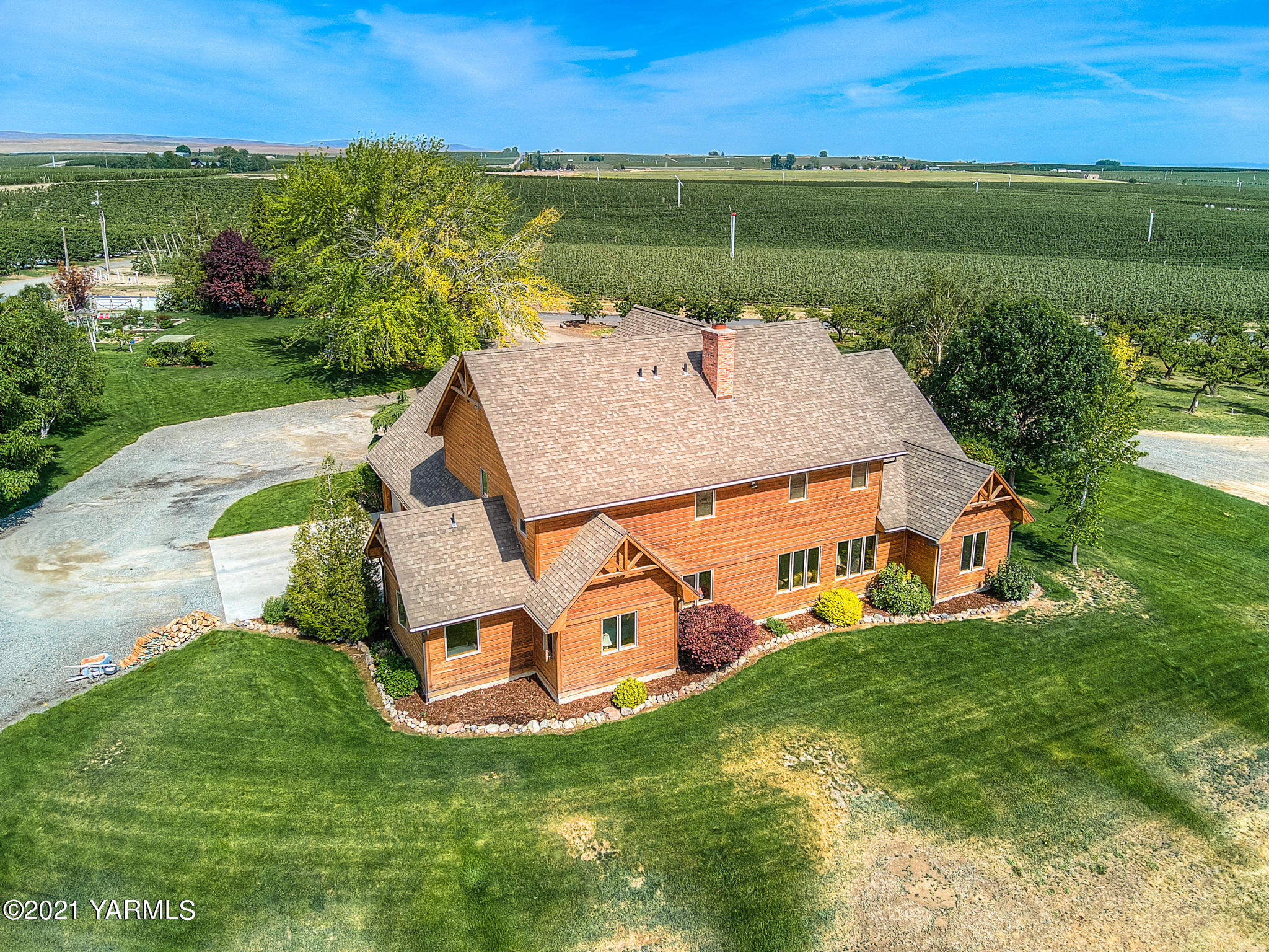 3050 Thacker Road Zillah, WA 98953 - Photo 48 of 64 an aerial view of a house with a garden and lake view