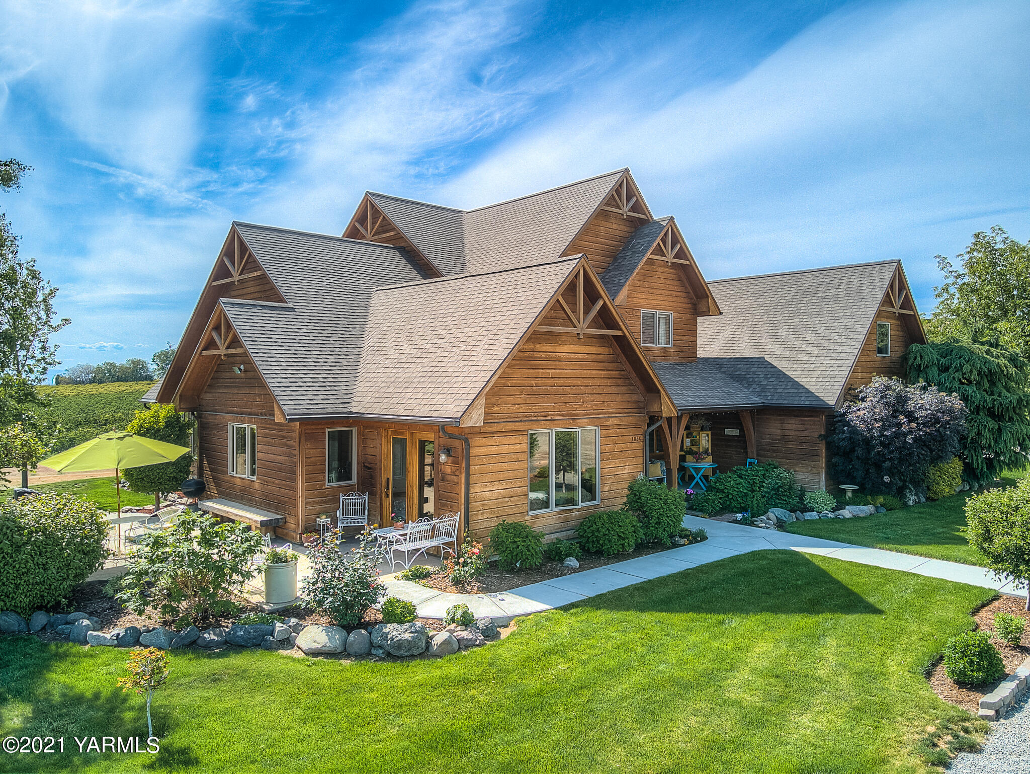 3050 Thacker Road Zillah, WA 98953 - Photo 49 of 64 a front view of a house with a yard and garage