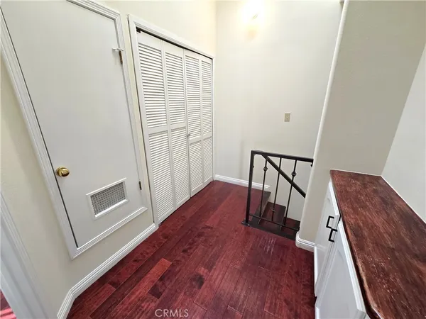 a view of wooden floor and stairs