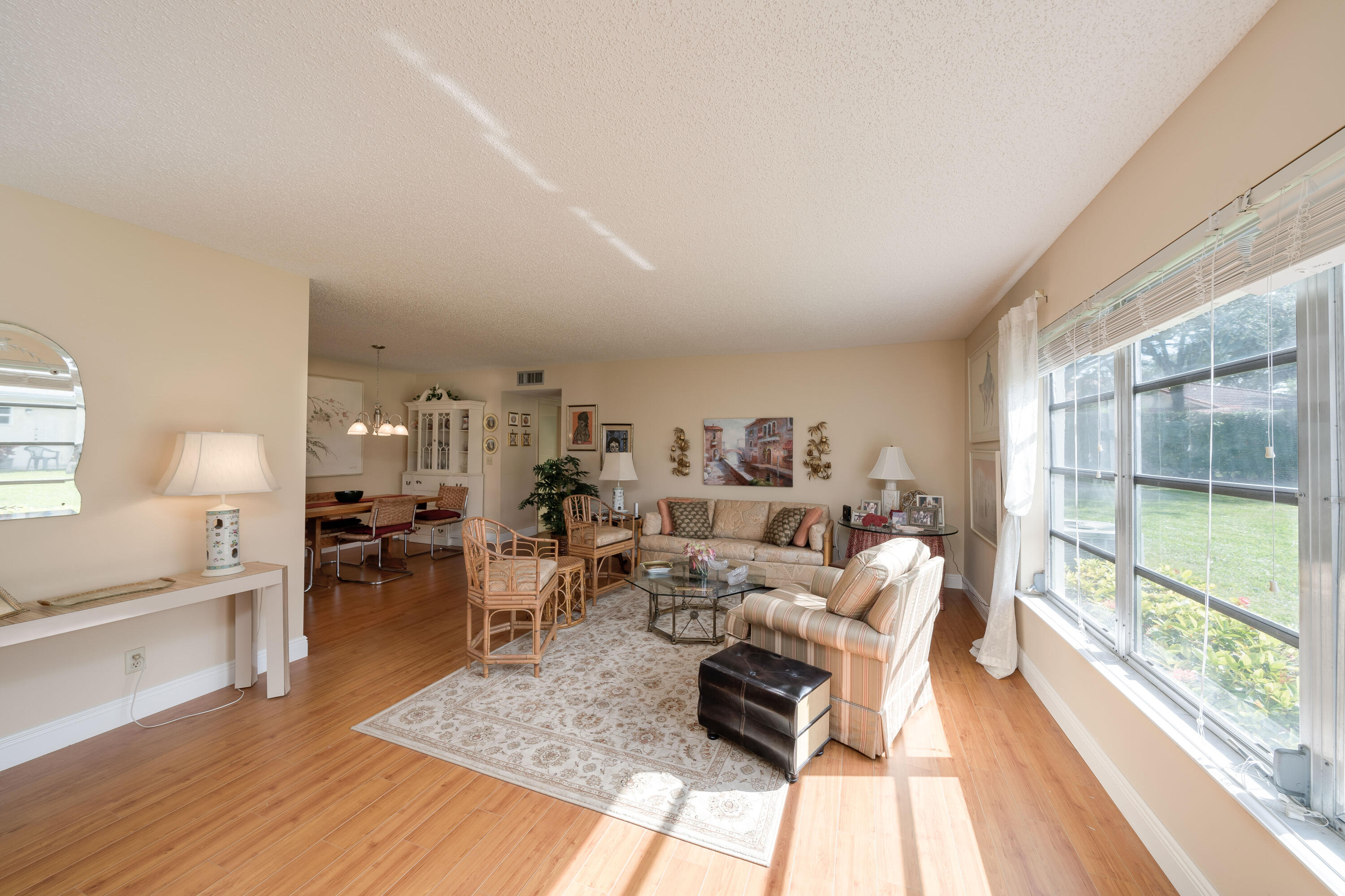 14240 Nesting Way, Unit D Delray Beach, FL 33484 - Photo 18 of 45 a living room with furniture and a large window