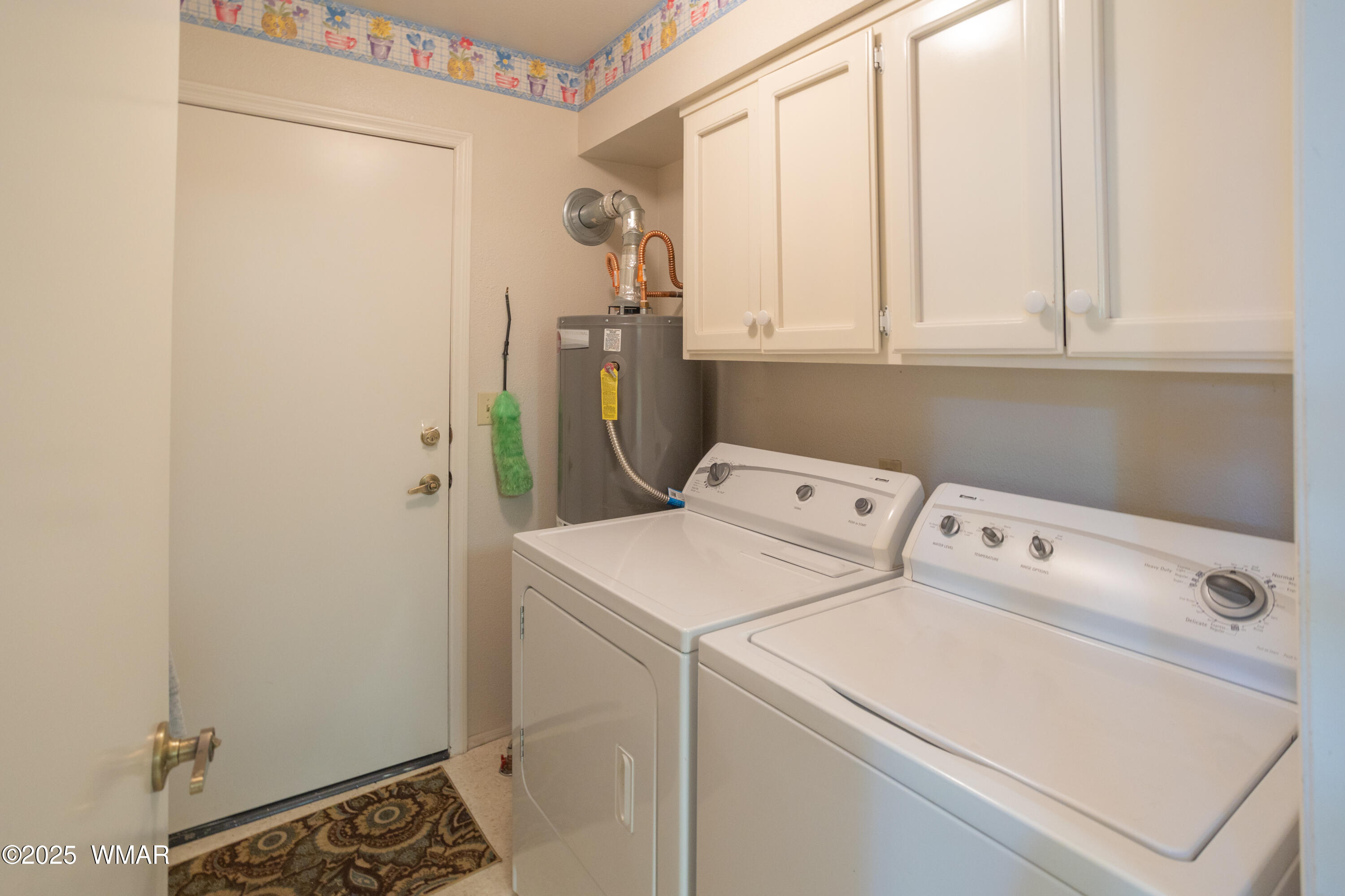2836 Oak Circle Pinetop, AZ 85935 - Photo 11 of 35 Laundry Room off kitchen with cabinets and door to garage