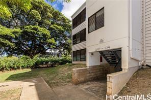 87-134 Helelua Street, Unit A302 Waianae, HI 96792 - Photo 16 of 16 a front view of a house with a yard