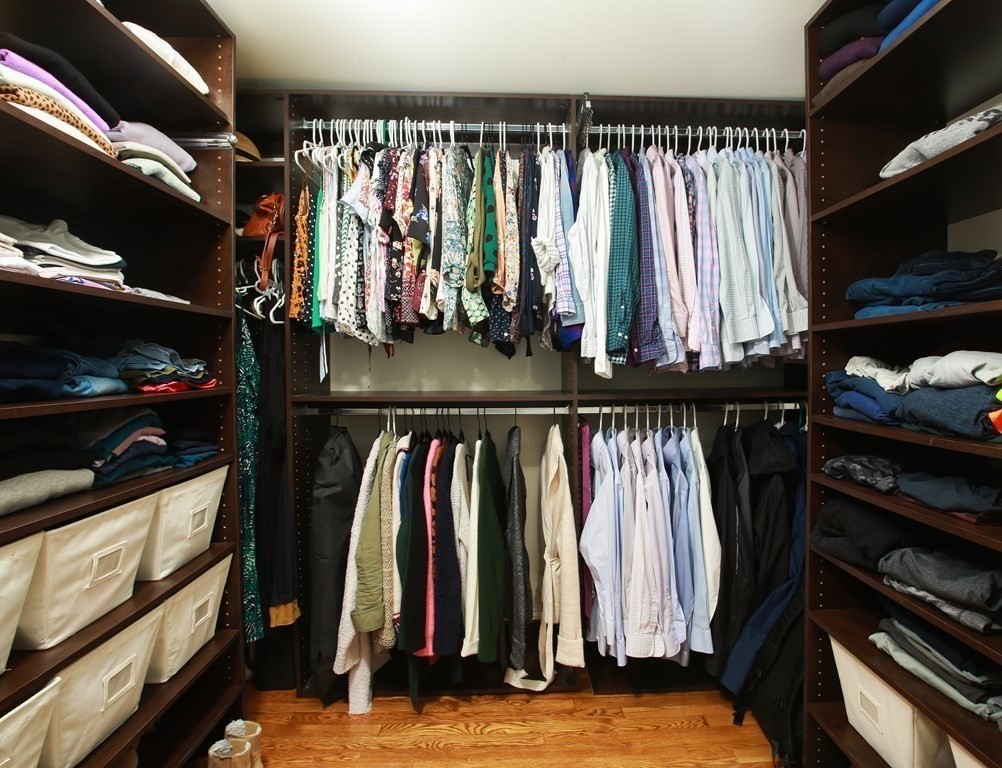 62 Sullivan Street, Unit 1 Boston, MA 02129 - Photo 7 of 11 a view of walk in closet with clothes and shoes