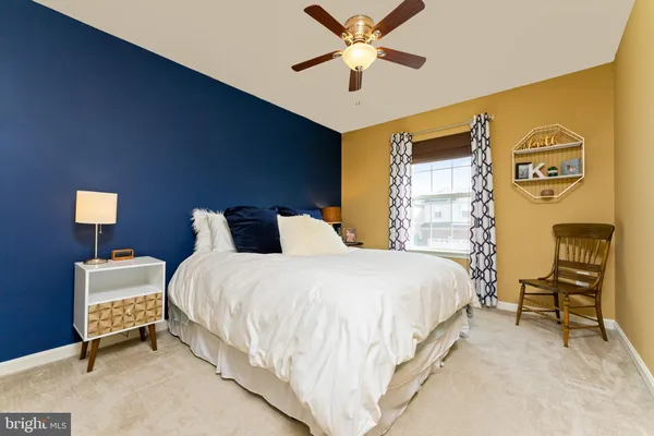a bedroom with bed and a window