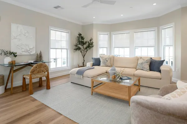 a living room with furniture and a large window