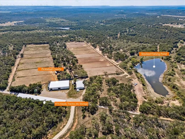 a view of a yard with trees