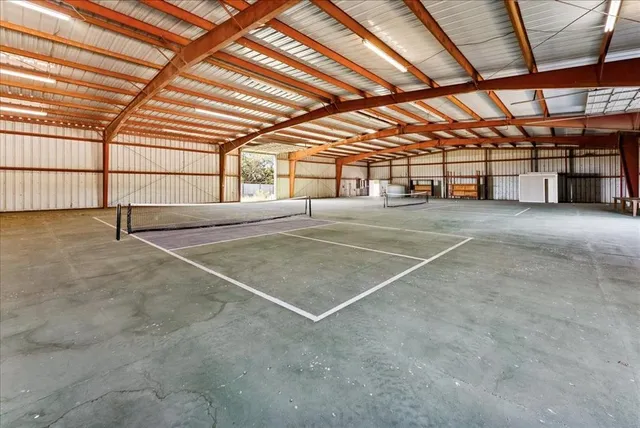a view of an empty room with a projector