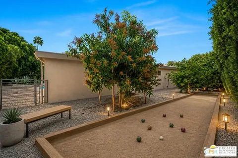 a view of a swimming pool with a yard