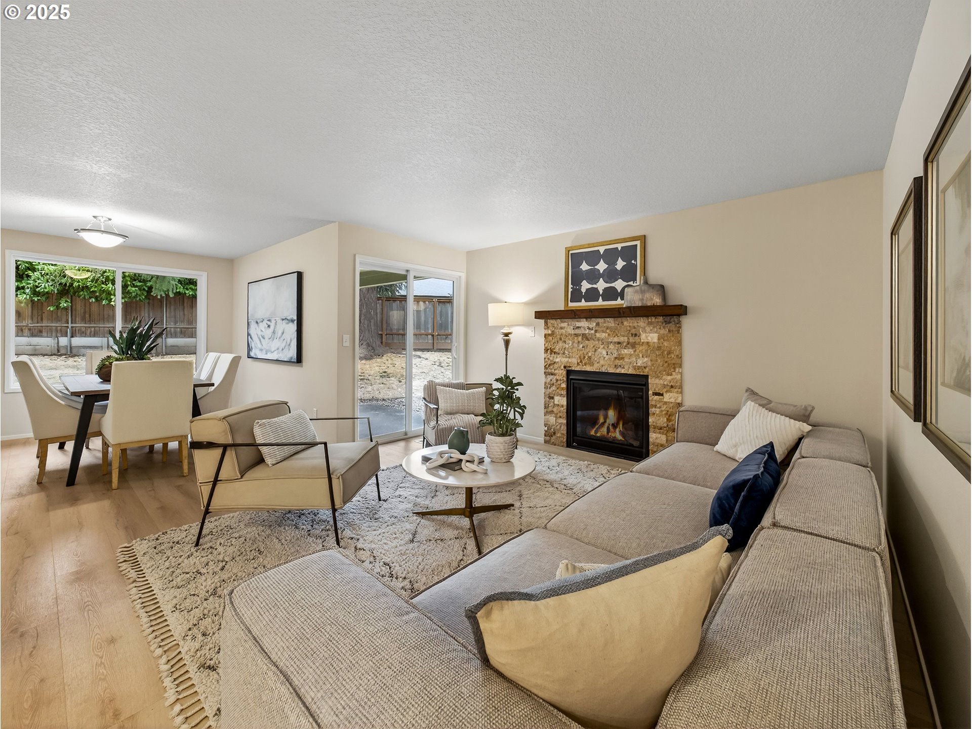 12945 Southwest Hackamore Court Beaverton, OR 97008 - Photo 11 of 48 a living room with furniture wooden floor and a fireplace