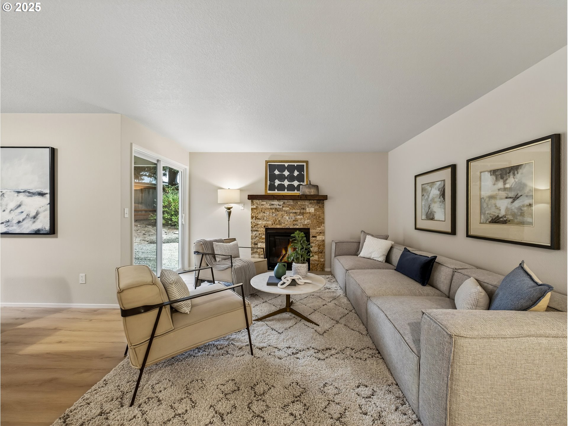 12945 Southwest Hackamore Court Beaverton, OR 97008 - Photo 13 of 48 a living room with furniture and a fireplace
