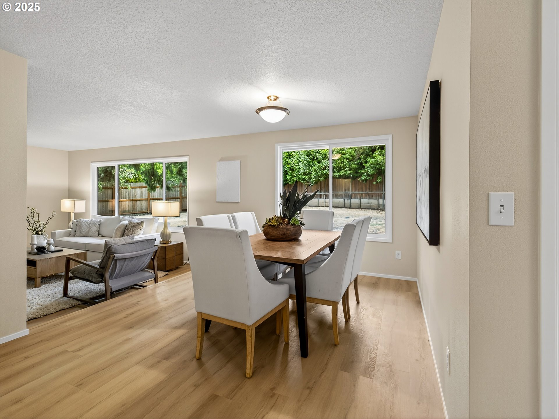 12945 Southwest Hackamore Court Beaverton, OR 97008 - Photo 16 of 48 a view of a dining room with furniture window and outside view