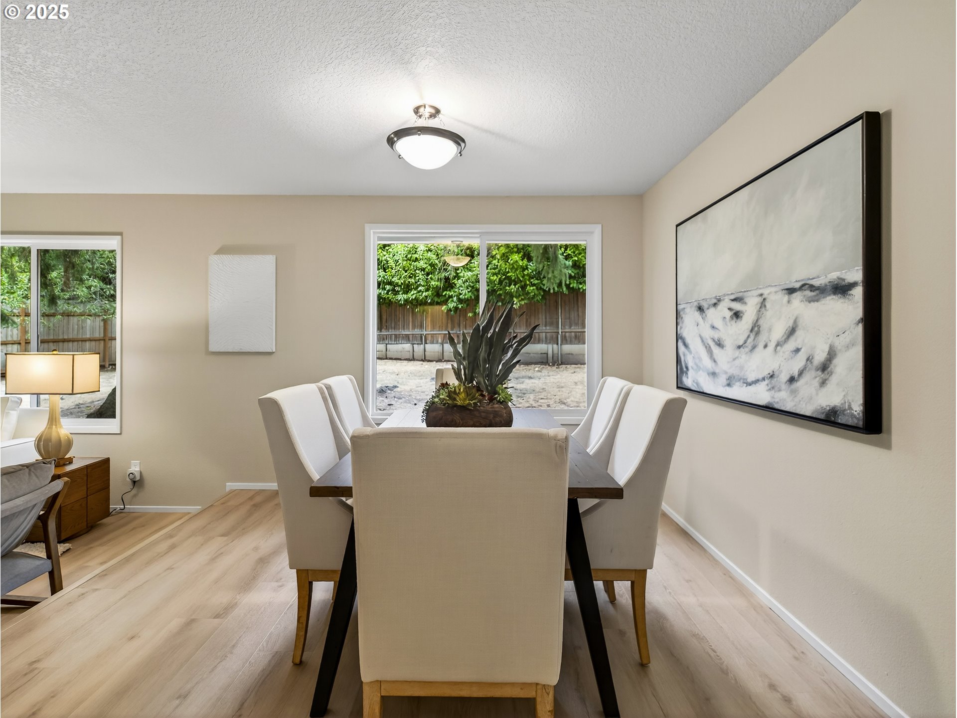 12945 Southwest Hackamore Court Beaverton, OR 97008 - Photo 17 of 48 a view of a dining room with furniture window and outside view