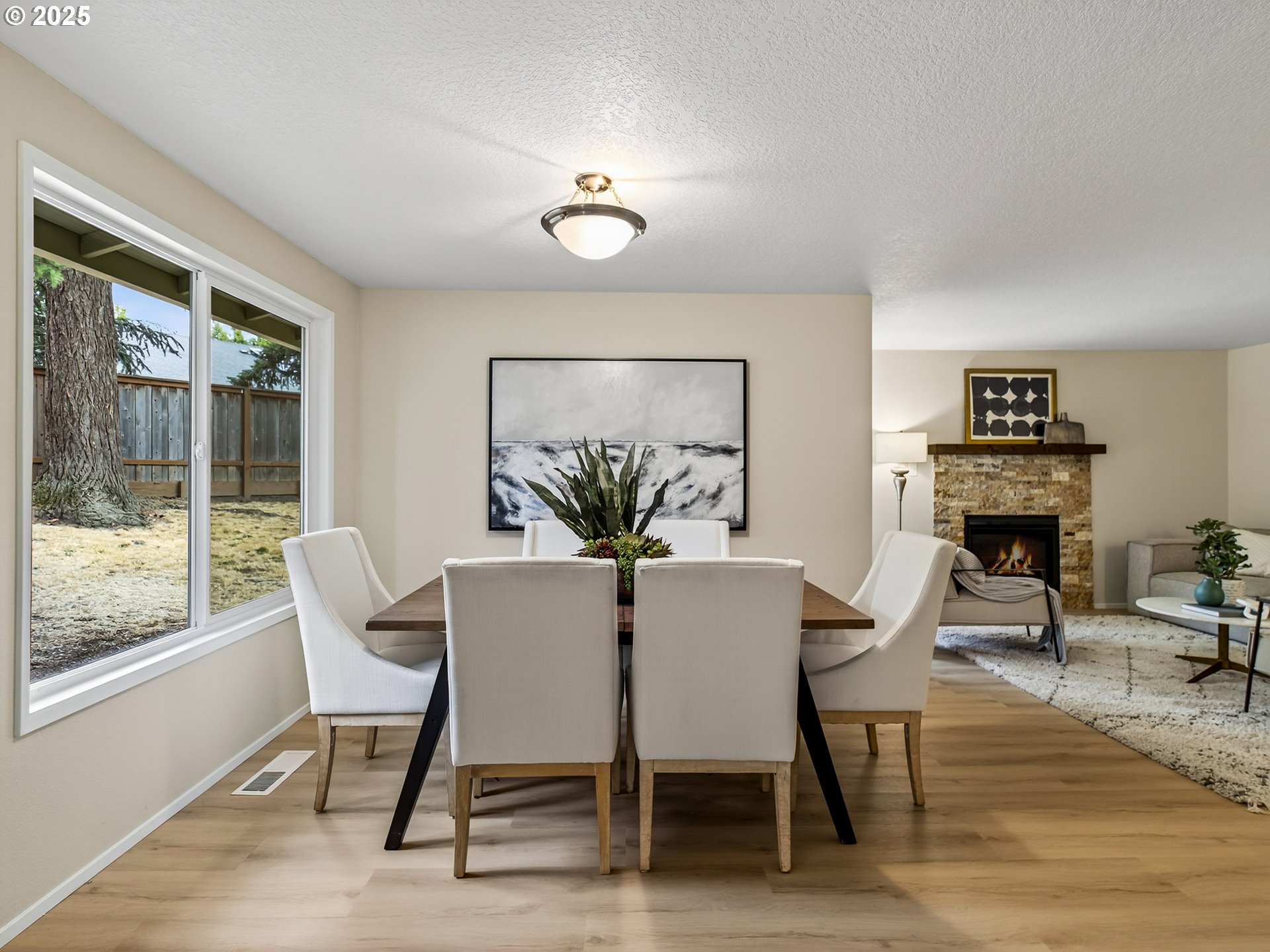 12945 Southwest Hackamore Court Beaverton, OR 97008 - Photo 18 of 48 a view of a dining room with furniture window and wooden floor