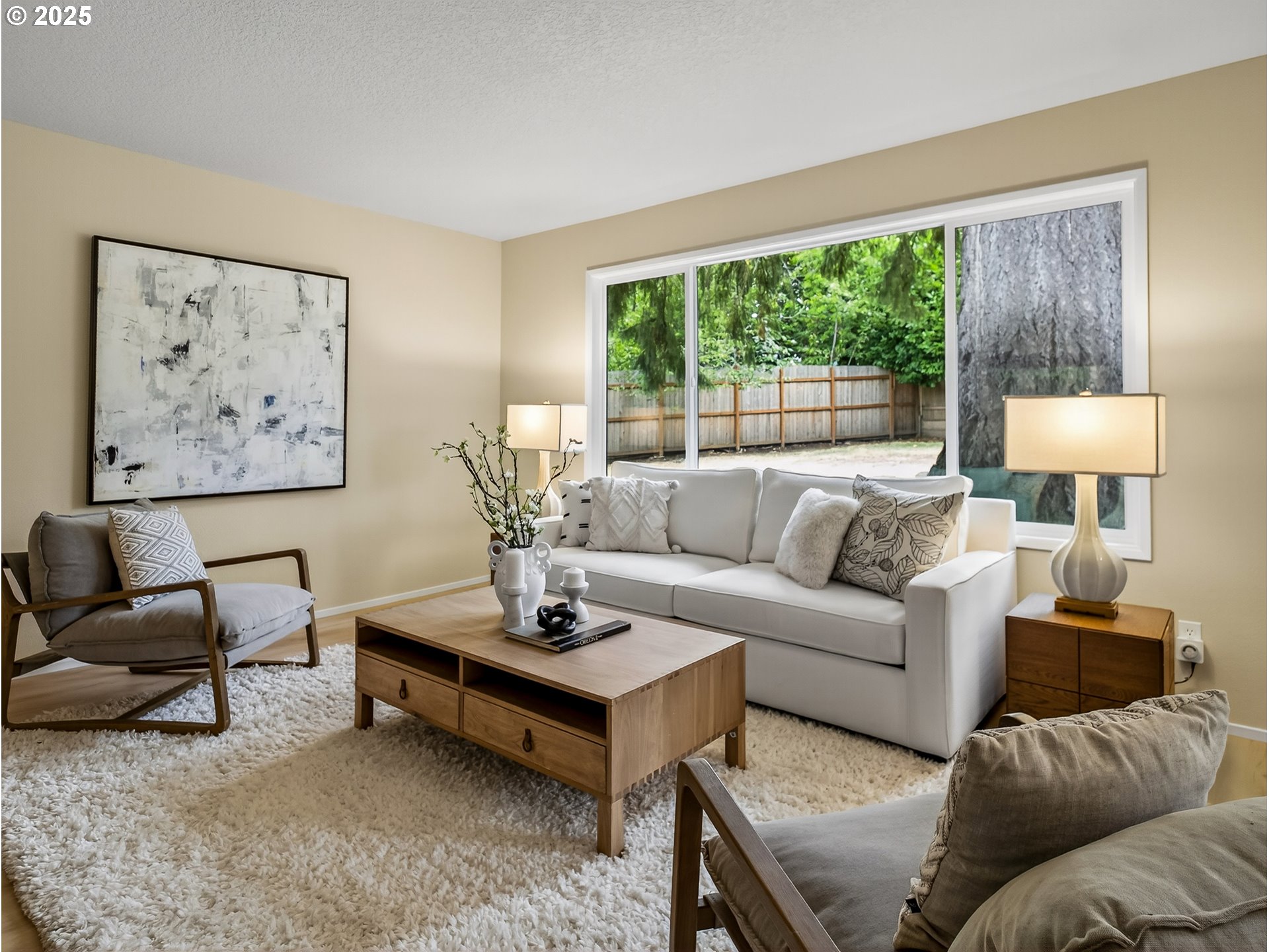 12945 Southwest Hackamore Court Beaverton, OR 97008 - Photo 19 of 48 a living room with furniture and a large window