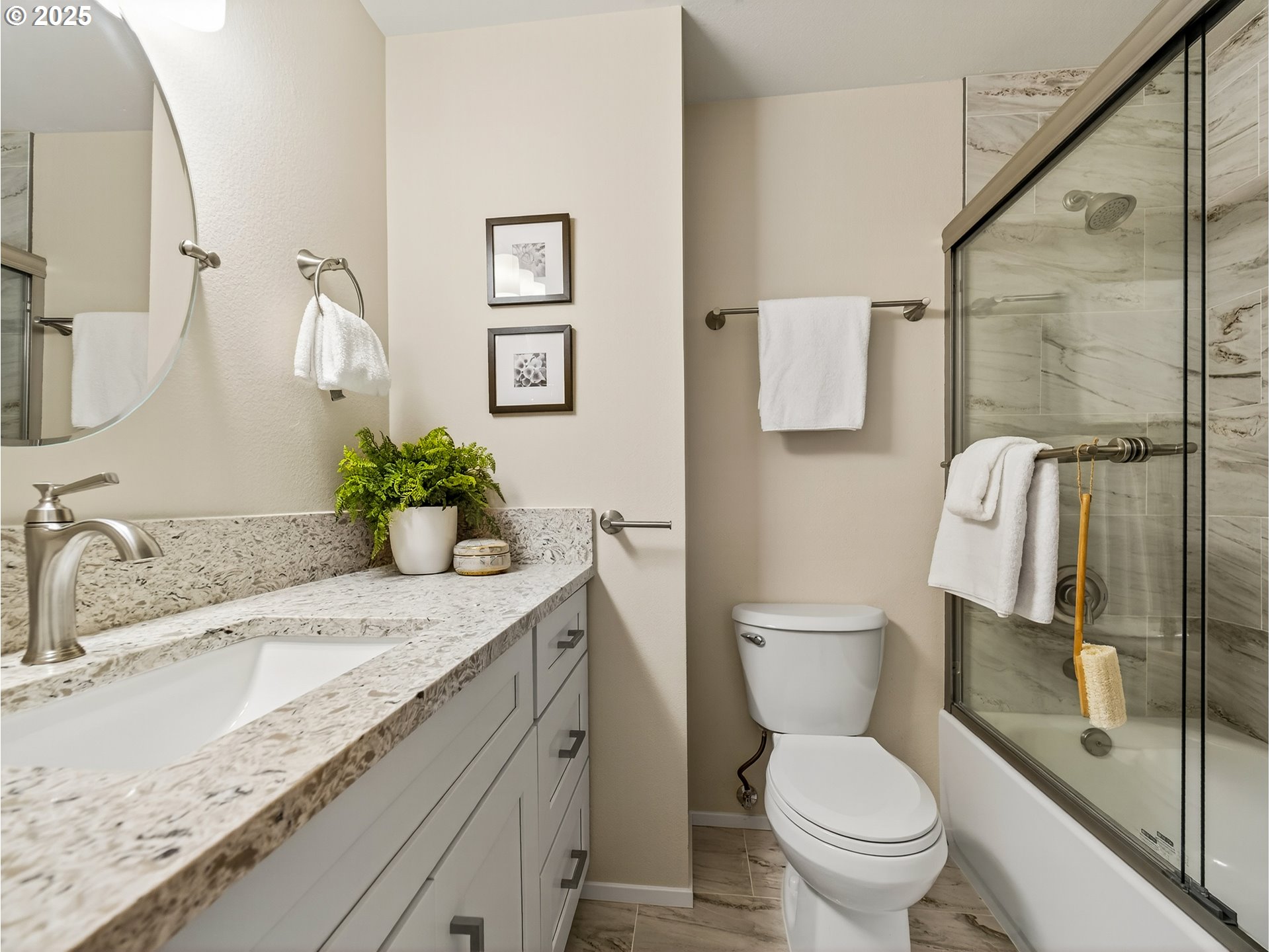12945 Southwest Hackamore Court Beaverton, OR 97008 - Photo 23 of 48 a bathroom with a granite countertop sink toilet and shower