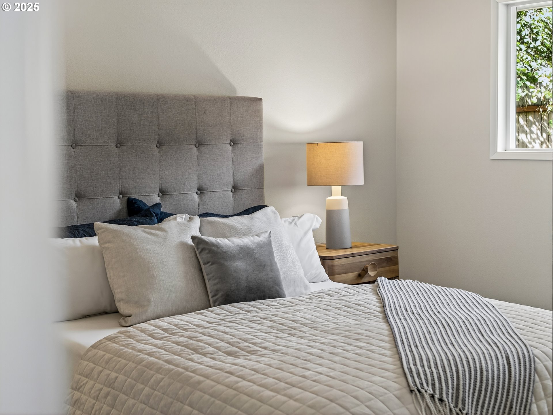 12945 Southwest Hackamore Court Beaverton, OR 97008 - Photo 25 of 48 a bedroom with a bed and a window