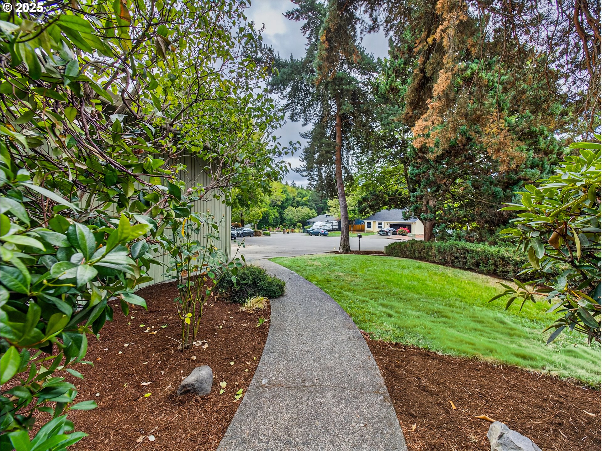 12945 Southwest Hackamore Court Beaverton, OR 97008 - Photo 32 of 48 a green field with trees in the background