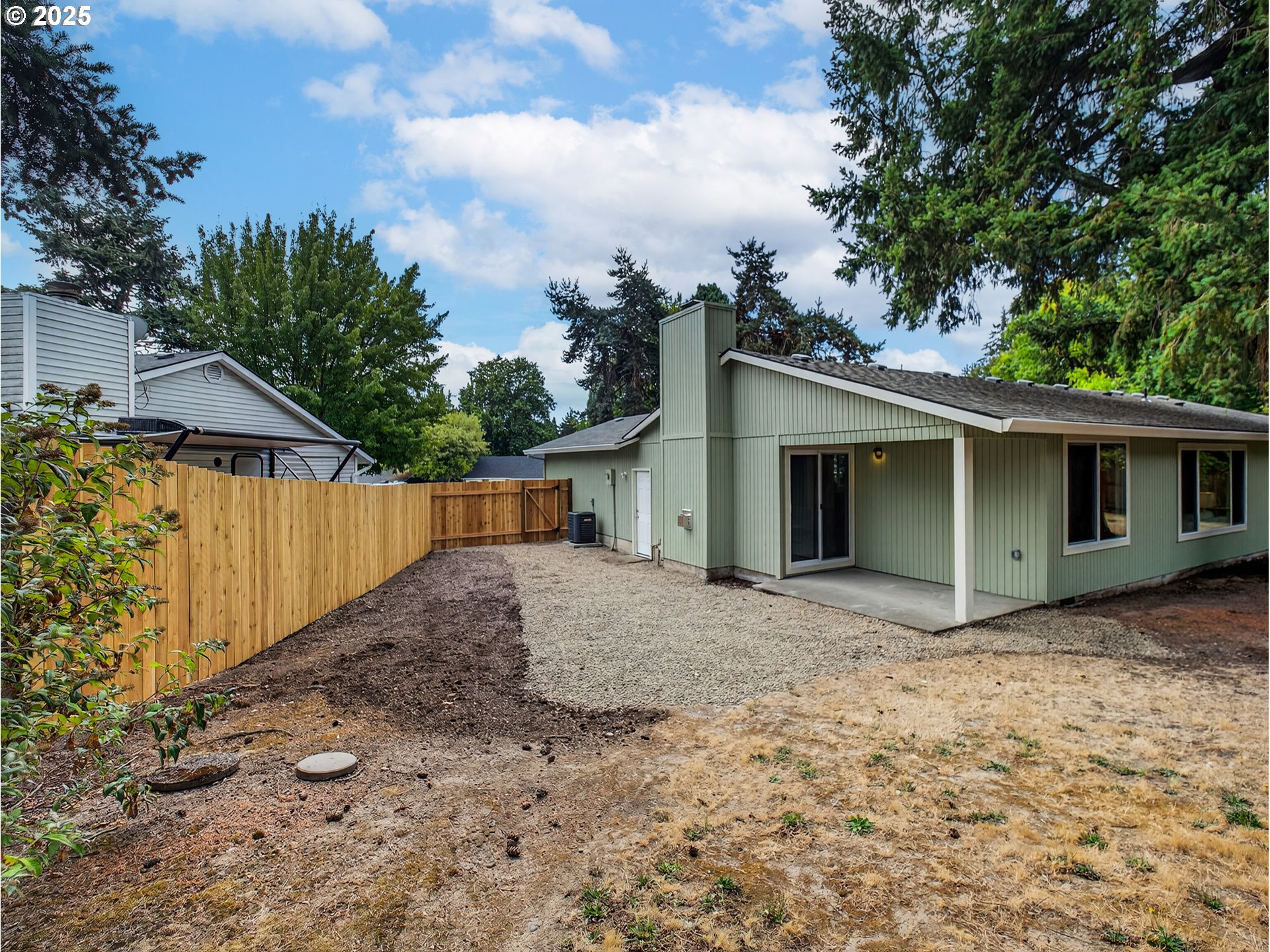 12945 Southwest Hackamore Court Beaverton, OR 97008 - Photo 36 of 48 a view of a house with a yard and garage