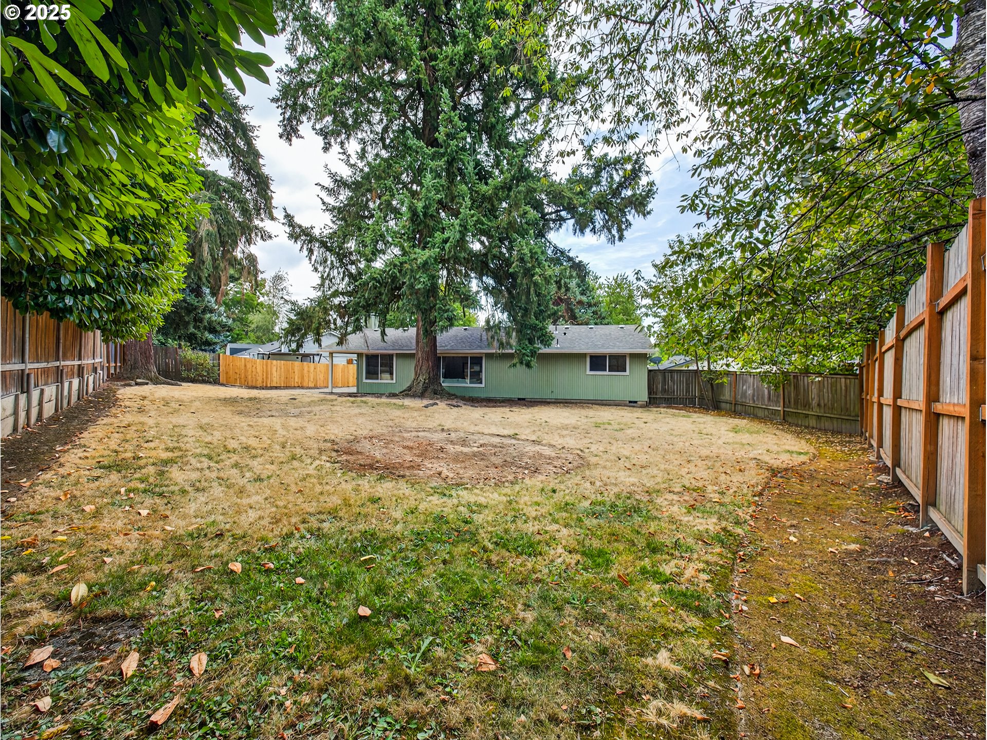 12945 Southwest Hackamore Court Beaverton, OR 97008 - Photo 39 of 48 a backyard of a house with oven and tree