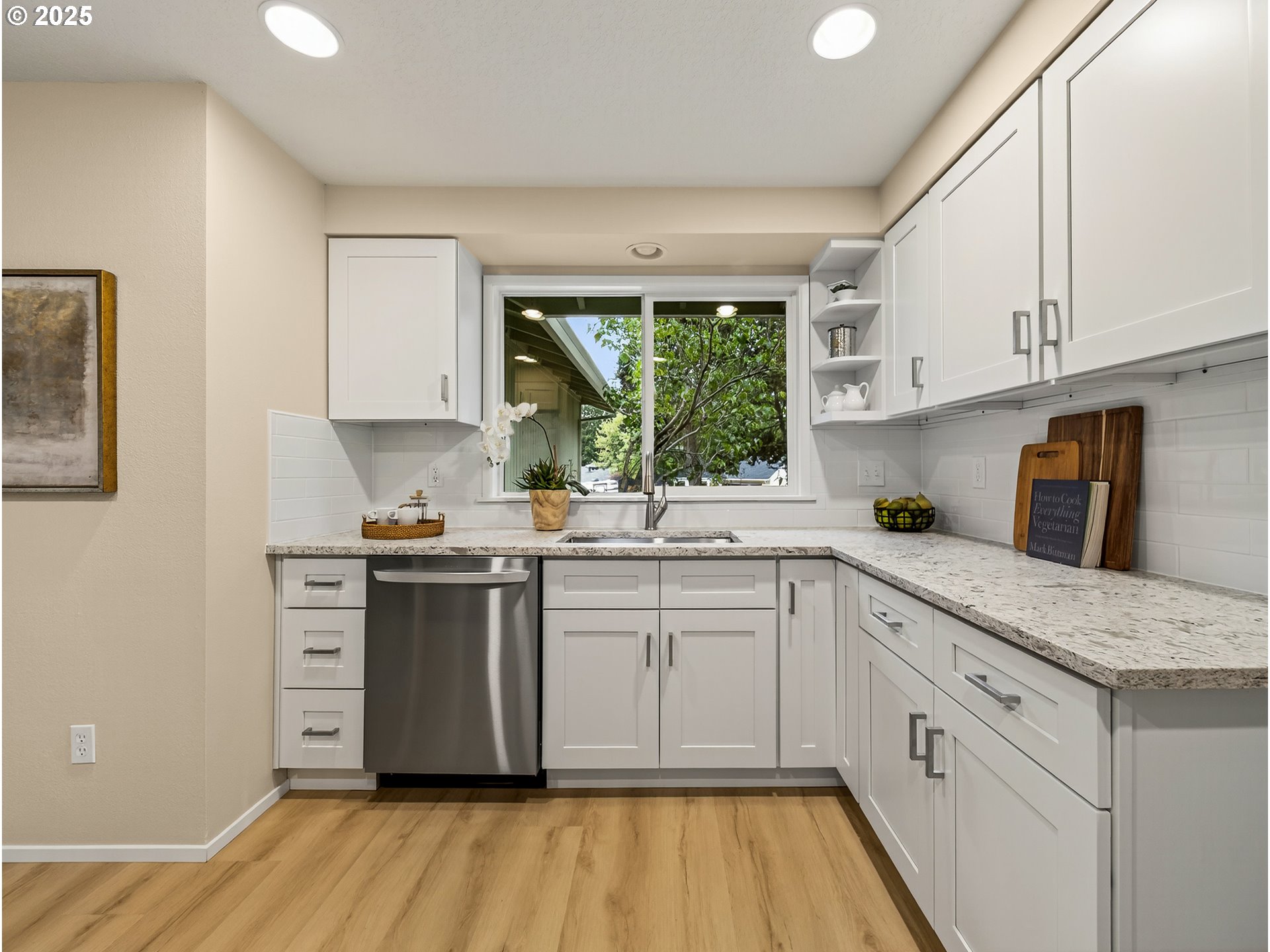 12945 Southwest Hackamore Court Beaverton, OR 97008 - Photo 8 of 48 a kitchen with cabinets appliances and a window