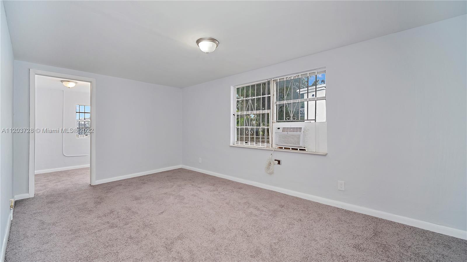 1910 Rutland Street Opa-Locka, FL 33054 - Photo 23 of 26 an empty room with windows