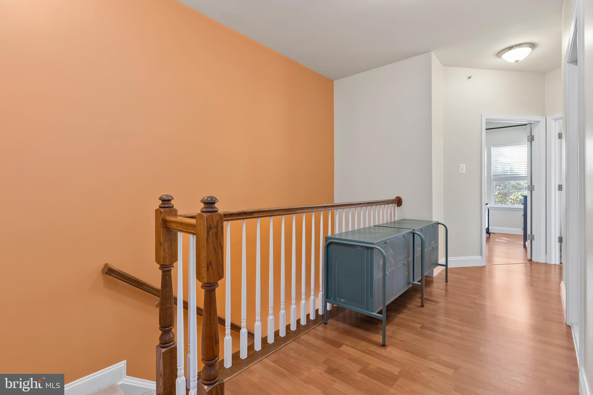 5787 Richards Valley Road Ellicott City, MD 21043 - Photo 30 of 52 wide hall way with rich laminate wood floor