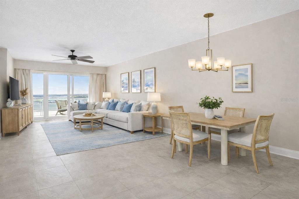 13113 Gasparilla Road, Unit 403 Placida, FL 33946 - Photo 16 of 62 a view of a dining room and livingroom with furniture wooden floor a chandelier