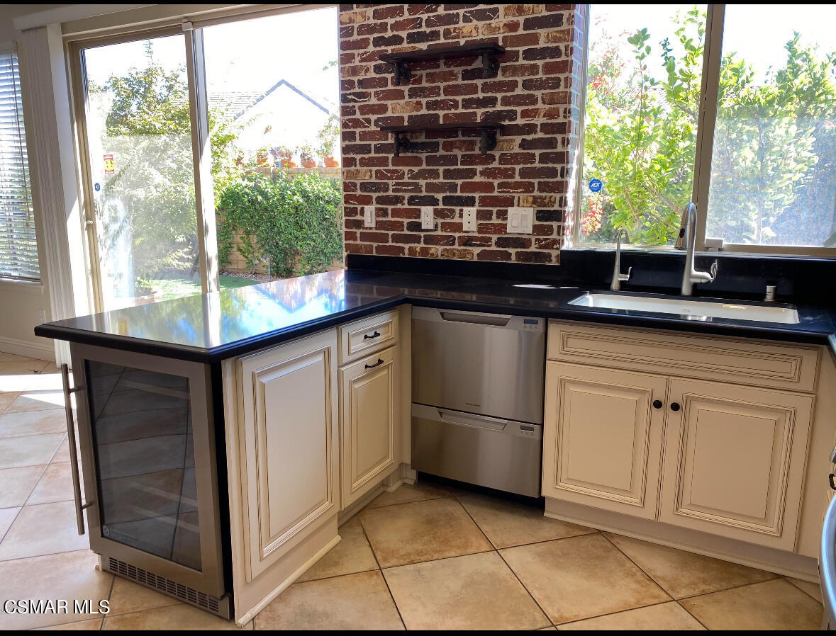 6770 Bountiful Lane Moorpark, CA 93021 - Photo 7 of 17 a kitchen with granite countertop a sink and a stove