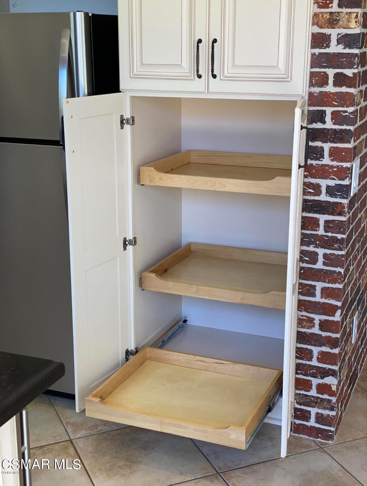6770 Bountiful Lane Moorpark, CA 93021 - Photo 8 of 17 a view of kitchen with refrigerator and cabinets
