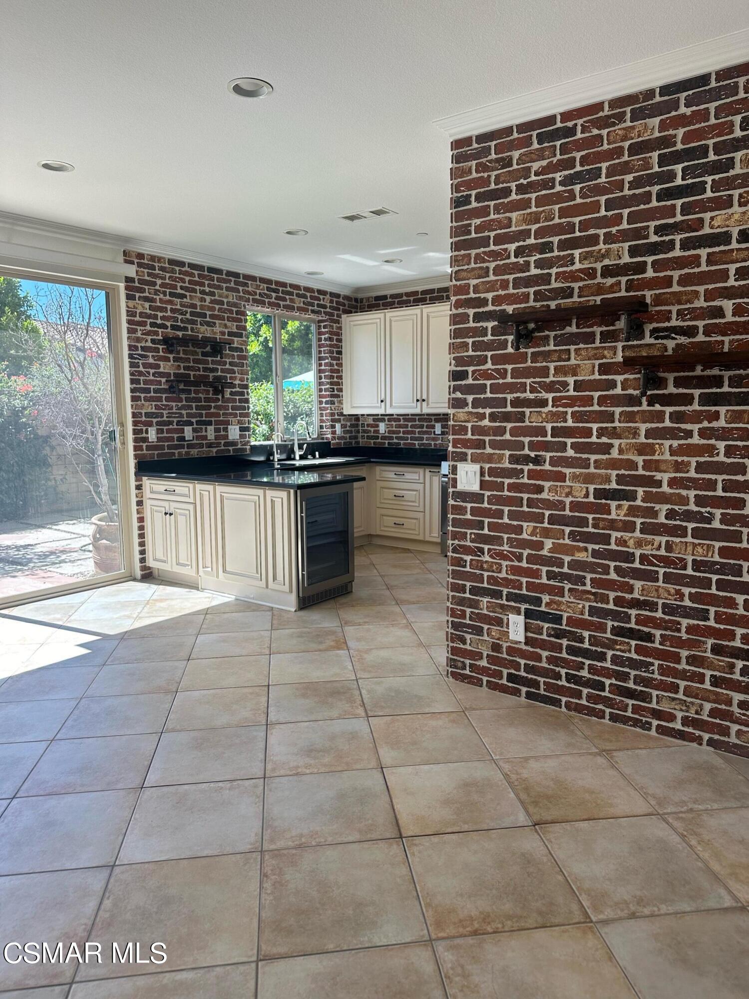 6770 Bountiful Lane Moorpark, CA 93021 - Photo 9 of 17 a kitchen with a sink a stove and cabinets