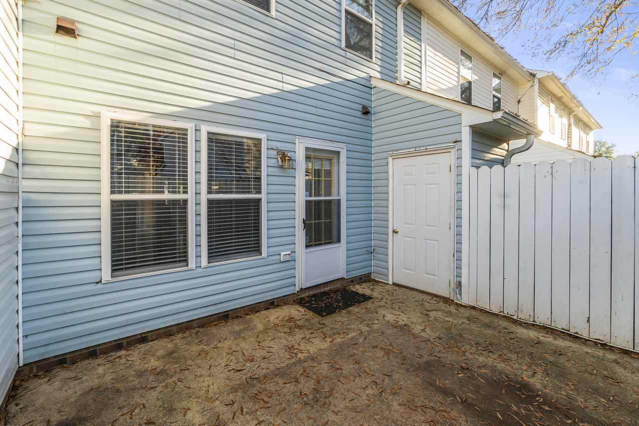 5946 Shady Grove Circle Raleigh, NC 27609 - Photo 10 of 11 Private & fenced concrete back patio provides additional space for entertaining guests and relaxation. Exterior Back