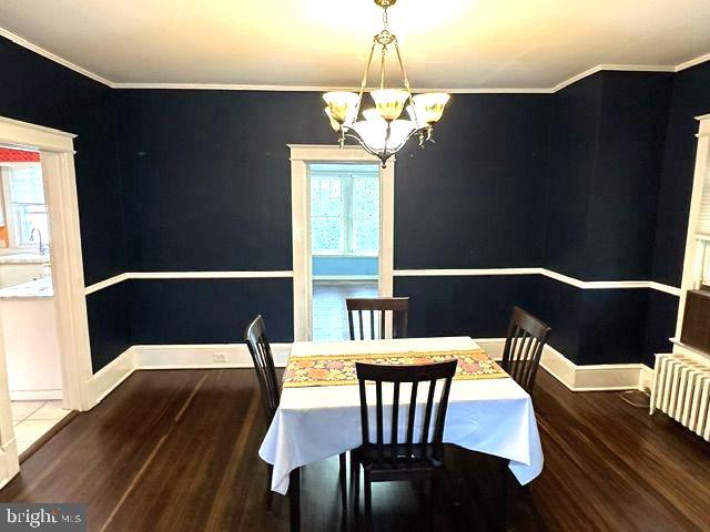 4608 West Virginia Avenue Bethesda, MD 20814 - Photo 20 of 61 a view of a dining room with furniture wooden floor and chandelier