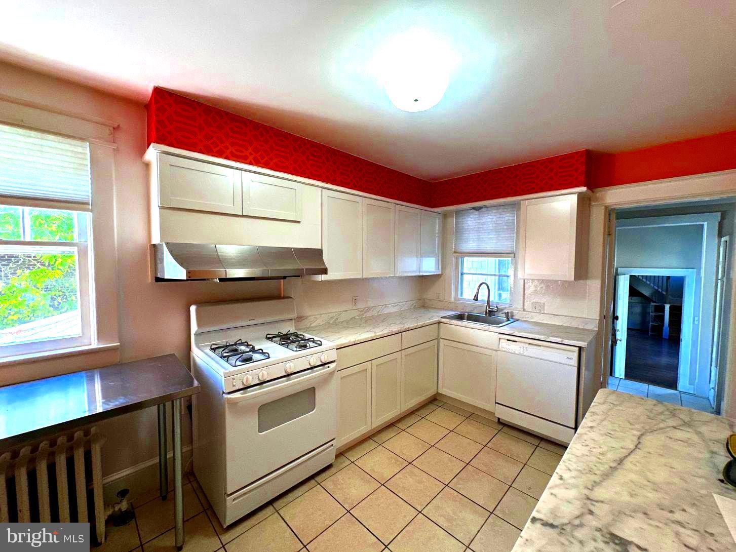 4608 West Virginia Avenue Bethesda, MD 20814 - Photo 29 of 61 a kitchen with a stove top oven and sink